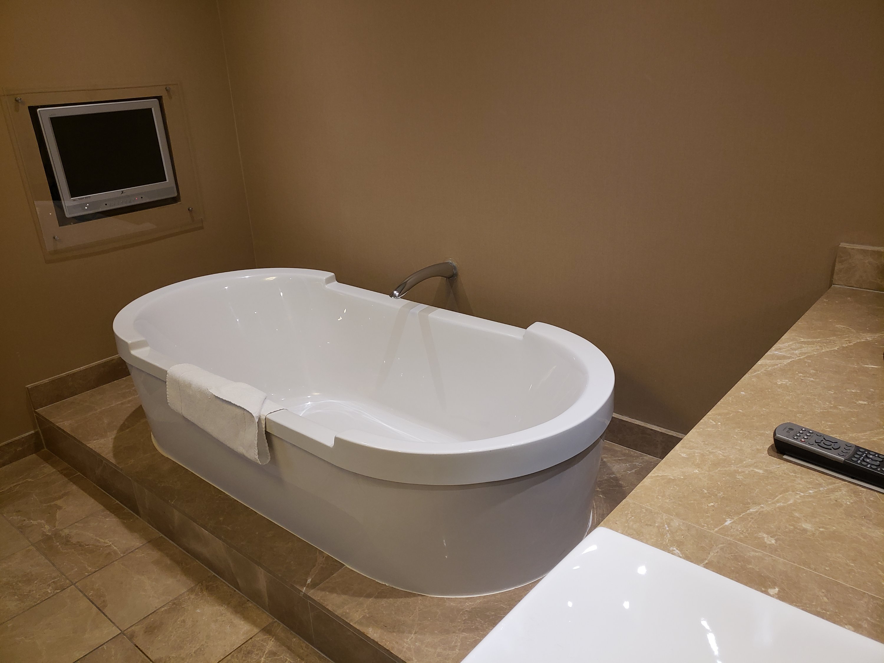 Large soaking tub in the bathroom of a hotel room in a Bettendorf Iowa hotel located at the Isle Hotel. Located in one of the casino's in Bettendorf Iowa. 