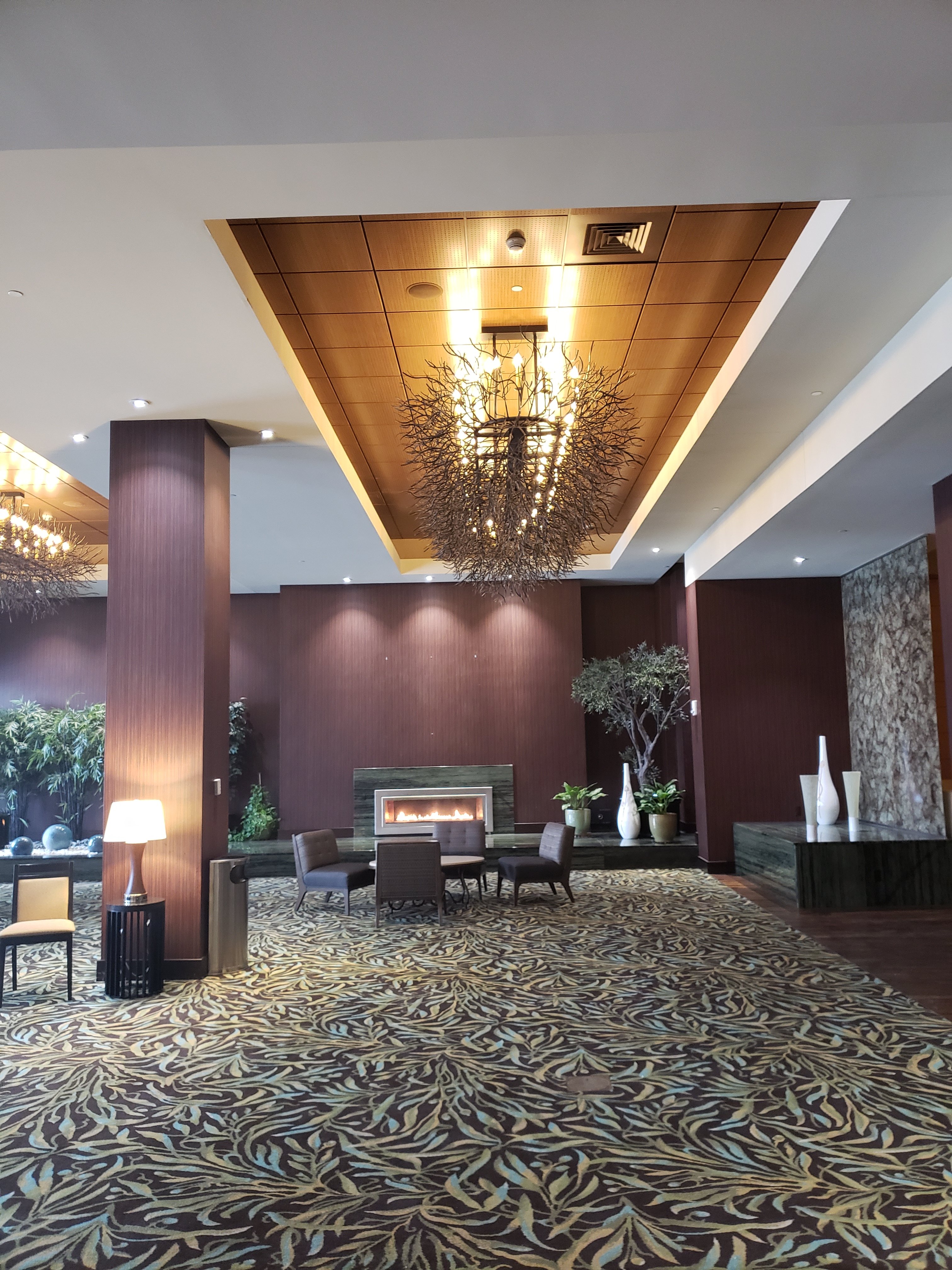 Lobby area with lamp, fireplace exquisite lighting and seating area at a Bettendorf Iowa hotel located at the Isle Hotel. This is in one of the casino's in Bettendorf Iowa. 