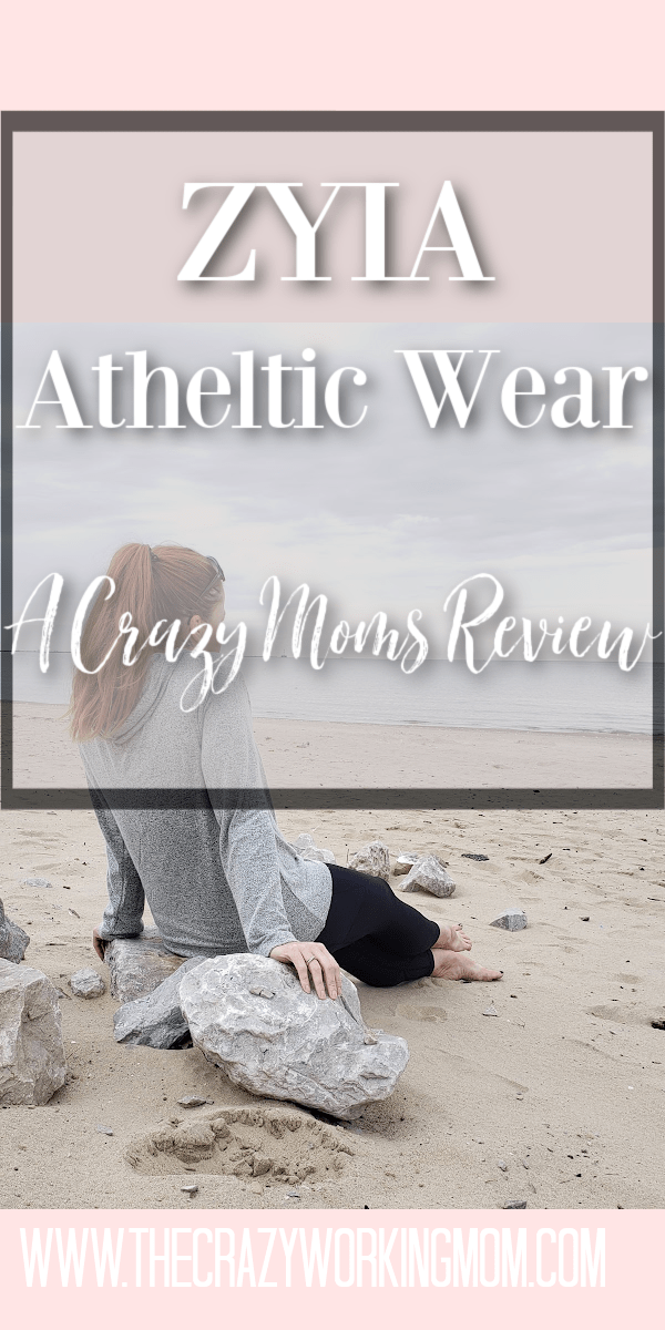 Woman wearing ZYIA athletic wear relaxing on the beach, sitting on a rock with "ZYIA athletic wear honest active wear review" text overlay