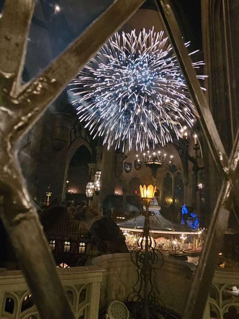 Fireworks over the carousel in Magic Kingdom at Walt Disney World as seen from Cinderella's Castle 