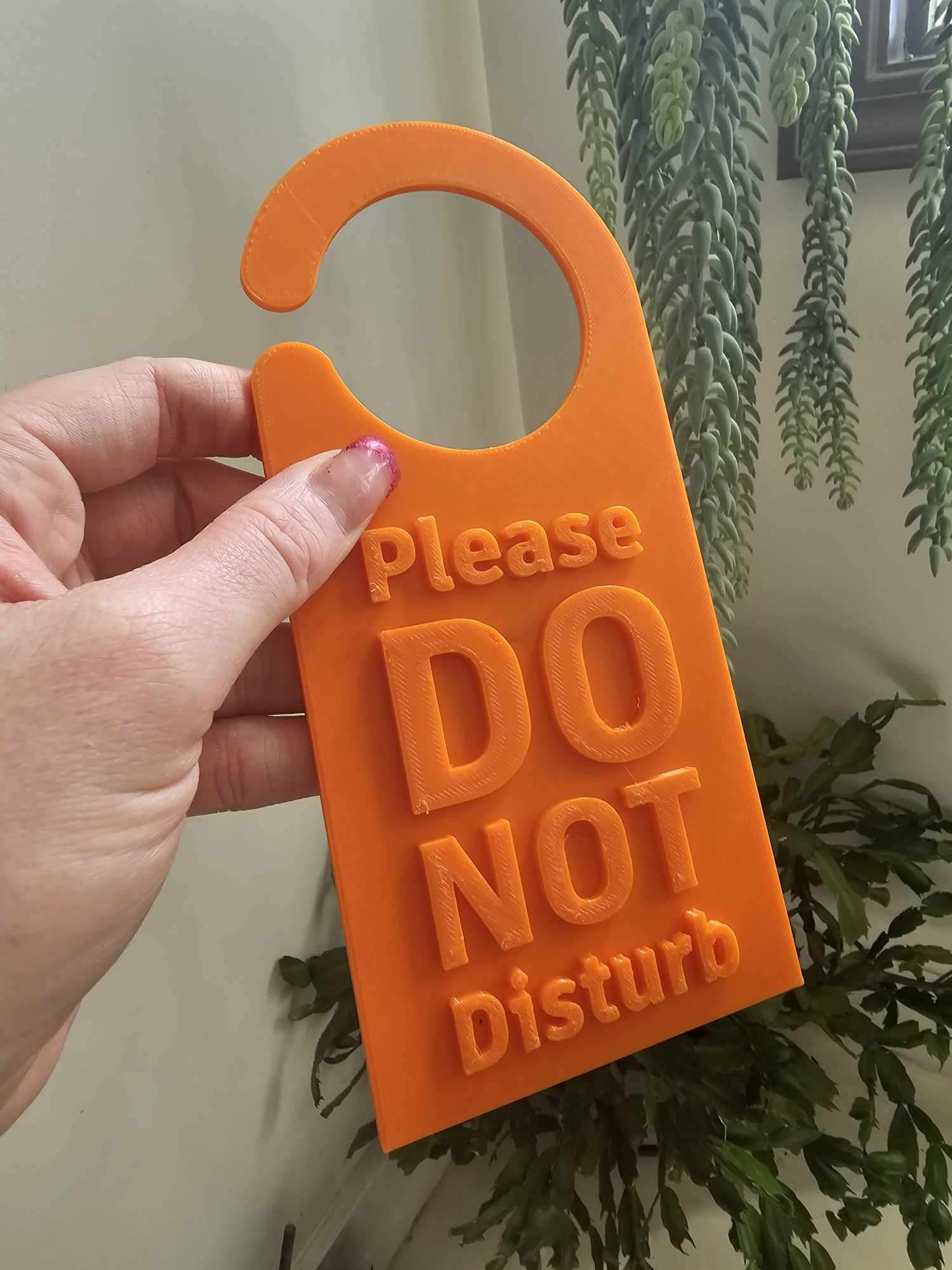 Orange do not disturb sign as a gift for remote workers work from home gifts idea